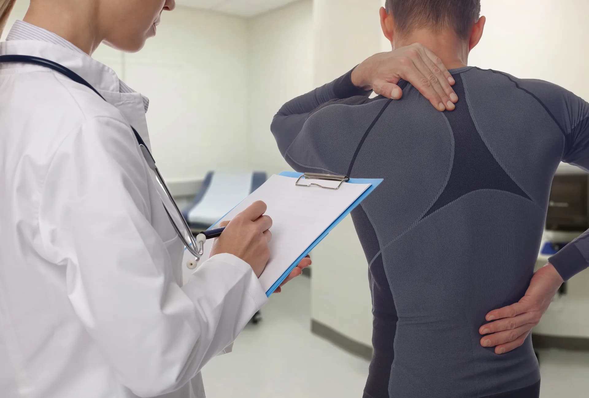 Practitioner working with a patient on lower-back release