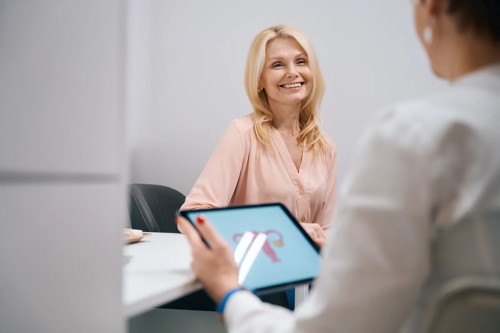 Clinician showing a patient information on a tablet