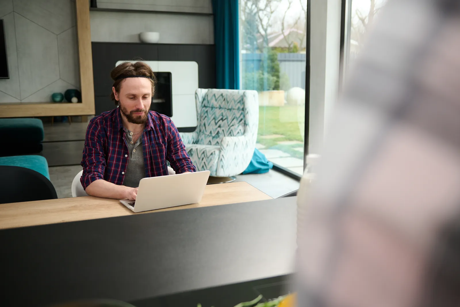 Contractor updating his website from a laptop in the office