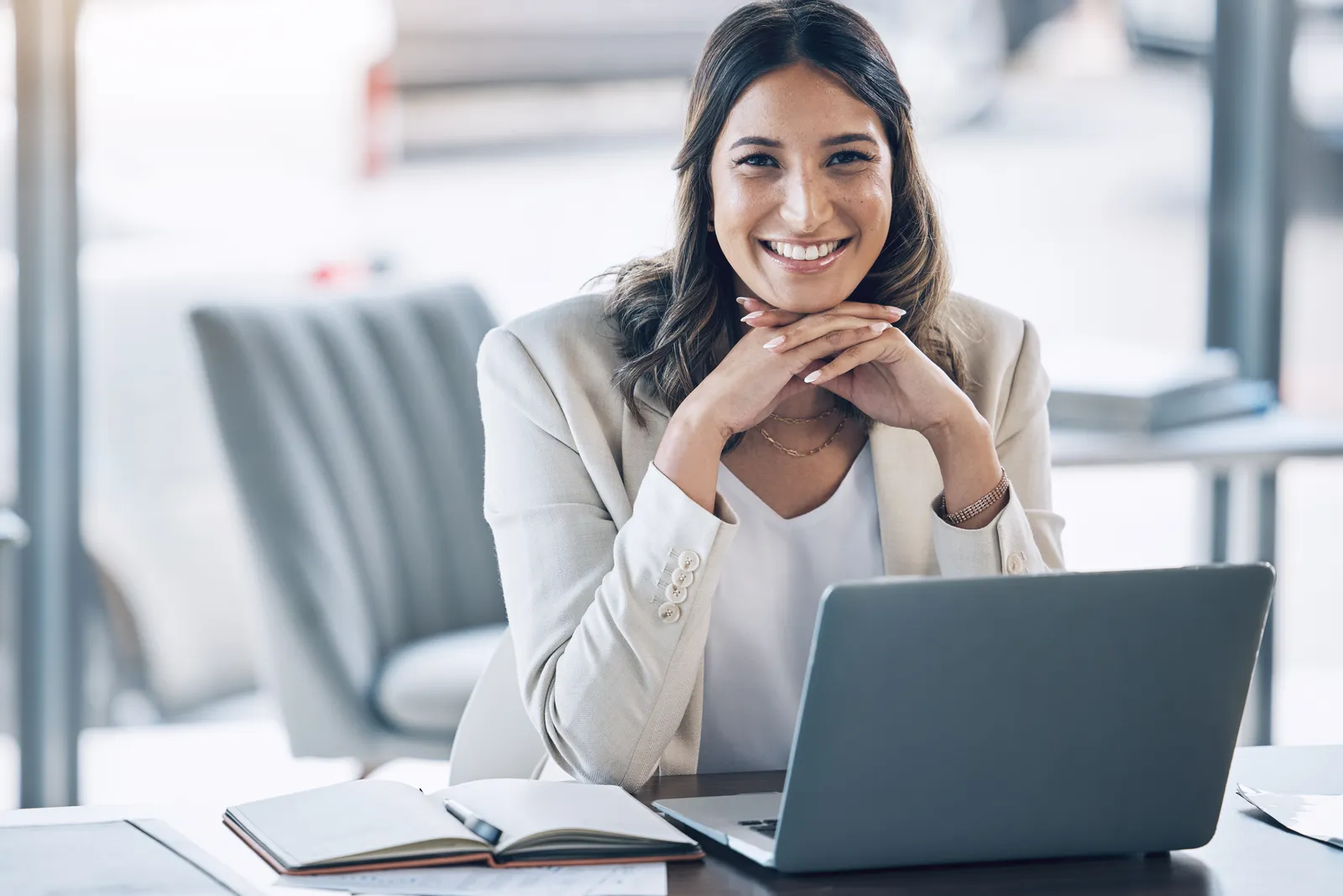 Lawyer at her desk with a laptop and case notes