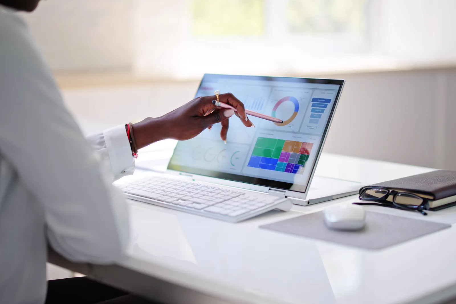 Clinician reviewing patient-acquisition dashboards on a tablet