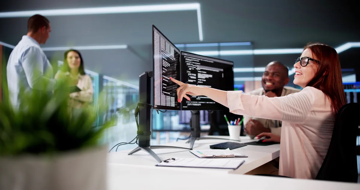 SEO specialist and developer reviewing a site crawl and content plan together on screen