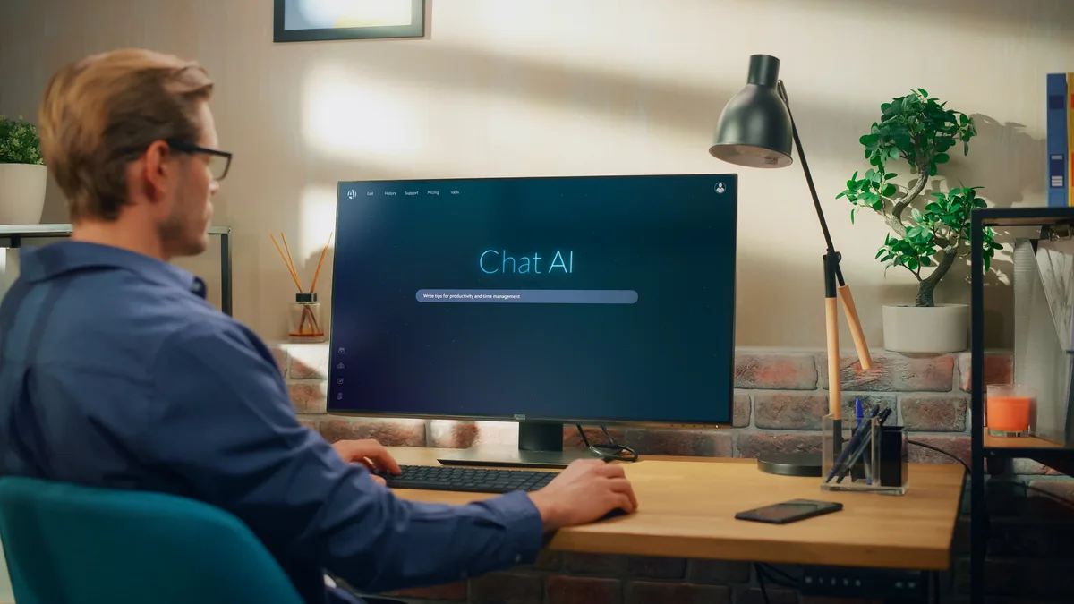 A marketing specialist analyzing how AI assistants cite businesses, reviewing AI-generated answers on a widescreen monitor