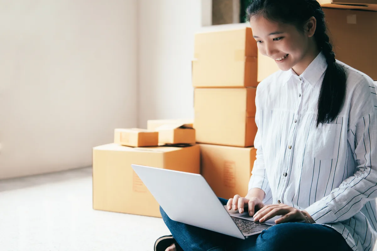 Service business owner reviewing automated email follow-ups to leads and past customers on a laptop