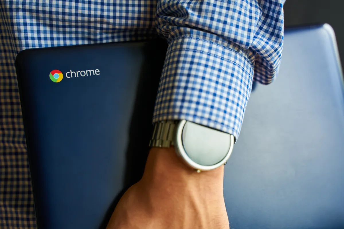 A Canadian small business owner reviewing Google Ads campaign performance on a laptop, deciding whether to bring in an agency