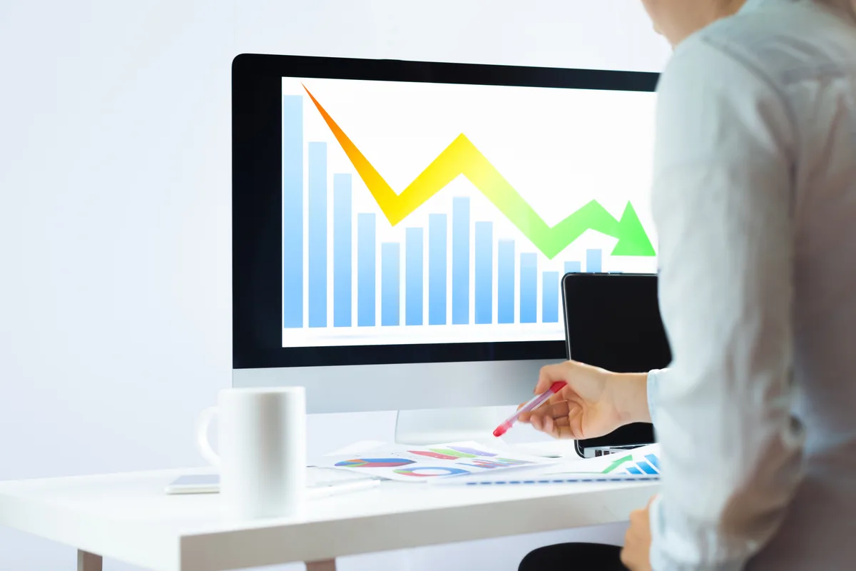 SEO specialist examining a sharp drop in organic traffic on an analytics dashboard after a Google core update