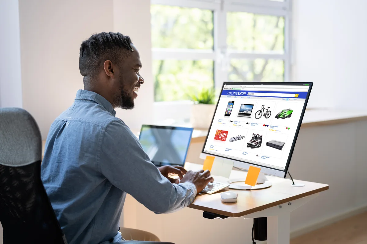 E-commerce manager reviewing product feed data and listing details on a desktop screen to resolve Merchant Center disapprovals