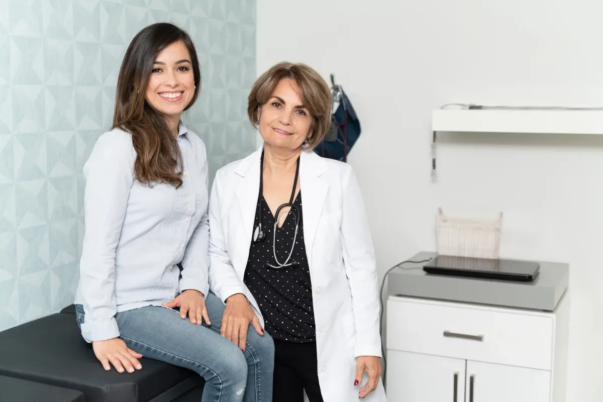 A direct primary care doctor talking with a patient during a longer, unhurried appointment