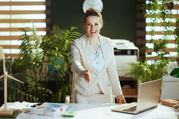 A business owner and a commercial lender reviewing loan terms together at a desk