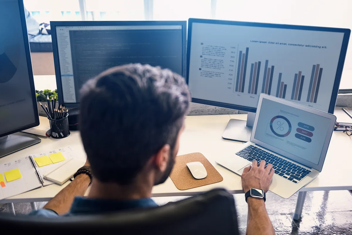 Marketing analyst conducting competitive intelligence research on rival ad campaigns