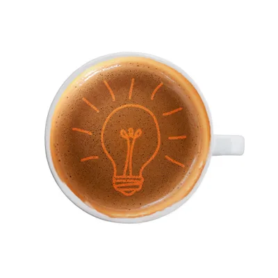 Overhead view of a coffee cup with a lightbulb sketched into the crema