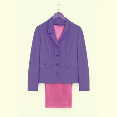 Iris-purple cropped wool blazer on a wooden hanger, layered over a rose velvet slip, against a pale butter-yellow wall