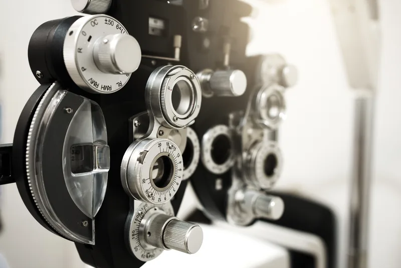 Close-up of a phoropter, the lens-switching instrument used to measure a glasses prescription