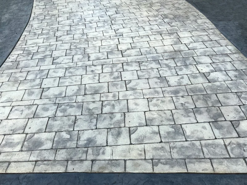 Gray stamped concrete in an ashlar slate pattern