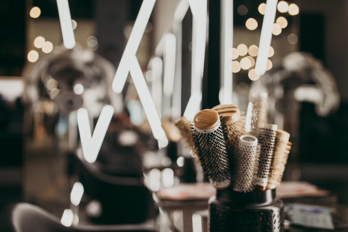 Stylist working with a client in a bright, modern salon