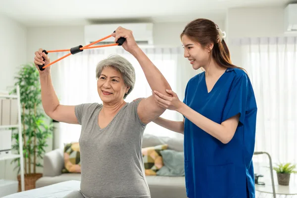 Caregiver assisting a senior resident at a senior care community