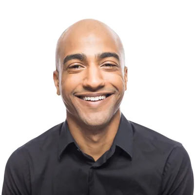 Portrait of Neil Brannock, smiling, in a dark shirt