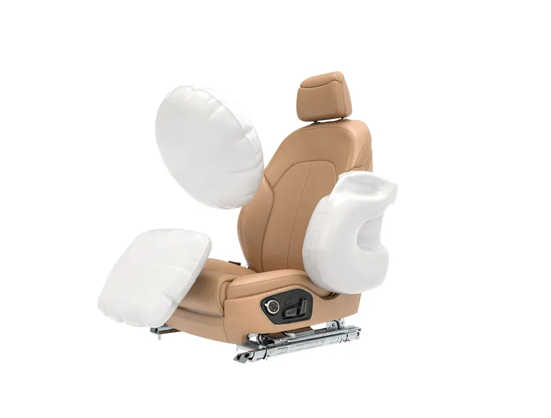 A car seat shown on its own with side and front airbags inflated around it