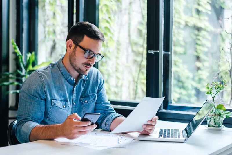 Accountant reviewing financial documents with a small-business client