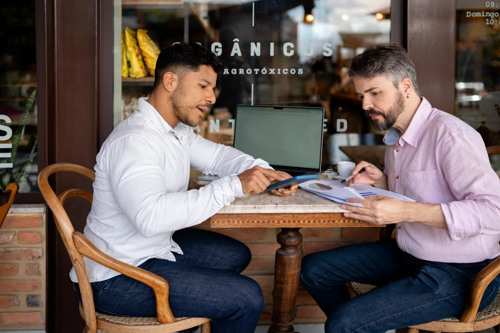Business lender sitting down with a small business owner to walk through loan options