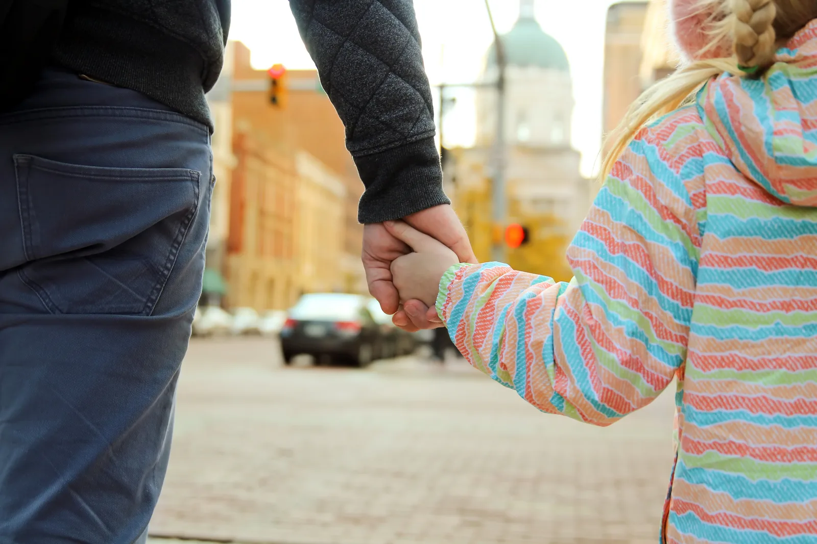 Child custody attorney reviewing a parenting-time schedule with a father at her office desk