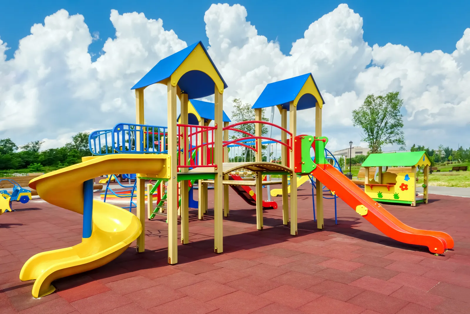 Empty playground with colorful slides and climbing equipment