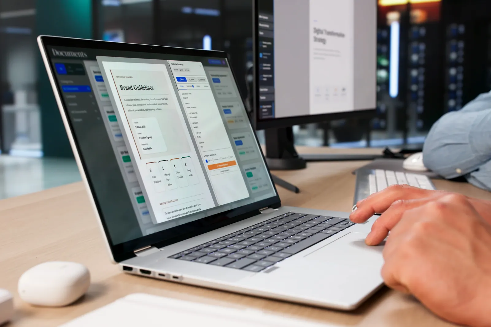 Marketer reviewing an A/B test results dashboard next to a laptop showing a landing page builder in progress