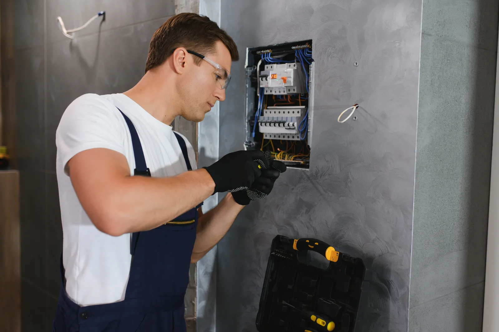 Licensed electrician replacing a breaker inside a home's electrical panel