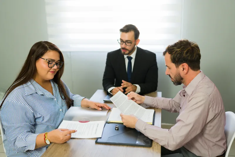Family law attorney meeting with a client about a divorce agreement