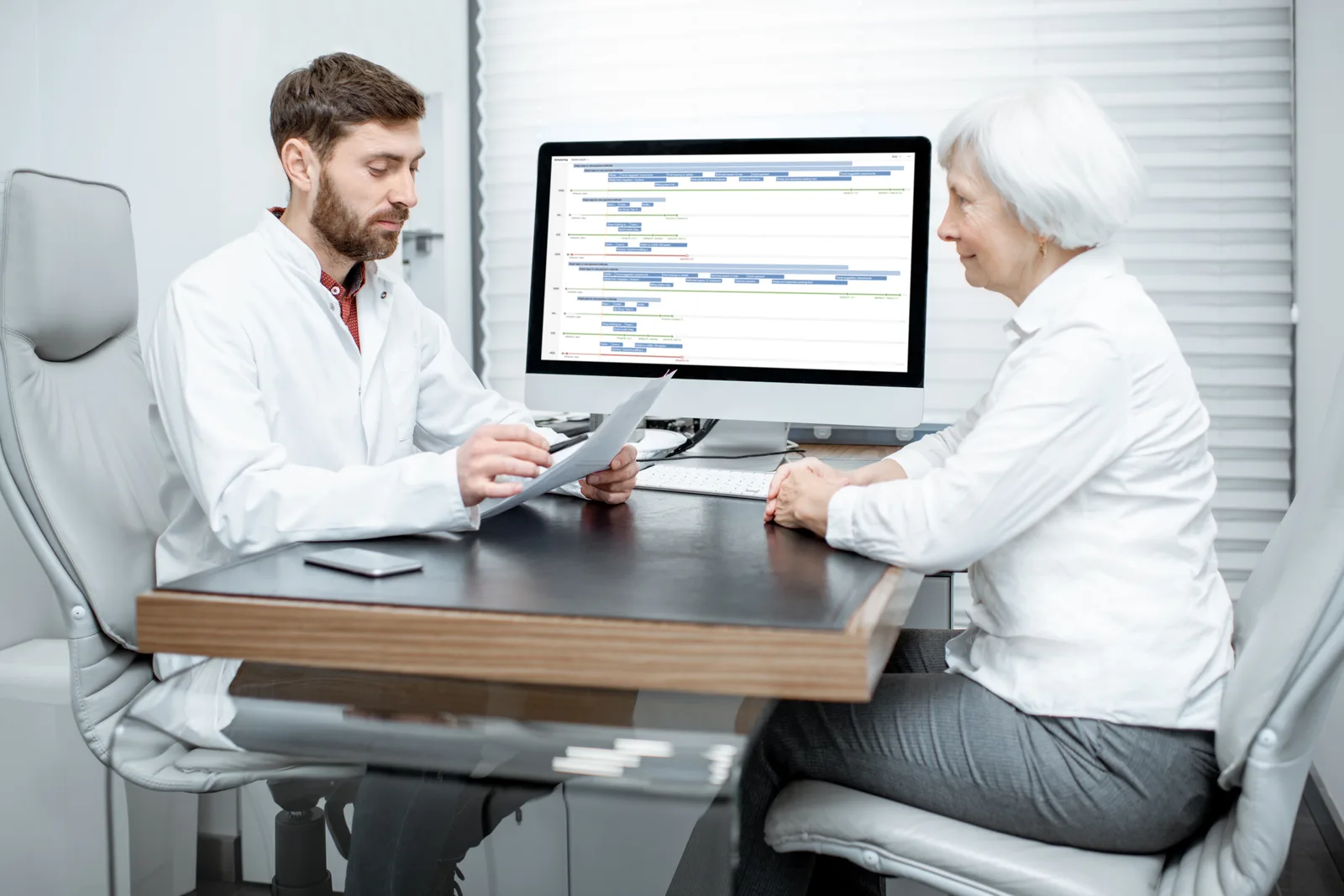 Functional medicine doctor reviewing lab results with a patient during an extended intake consultation