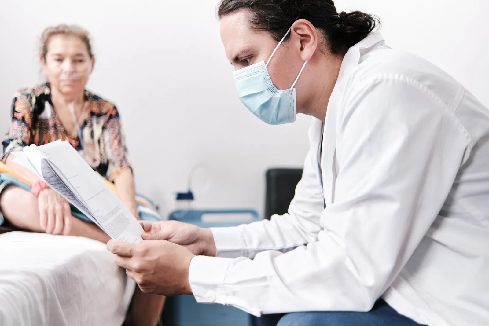 Infectious disease physician discussing test results with a patient during a clinic visit