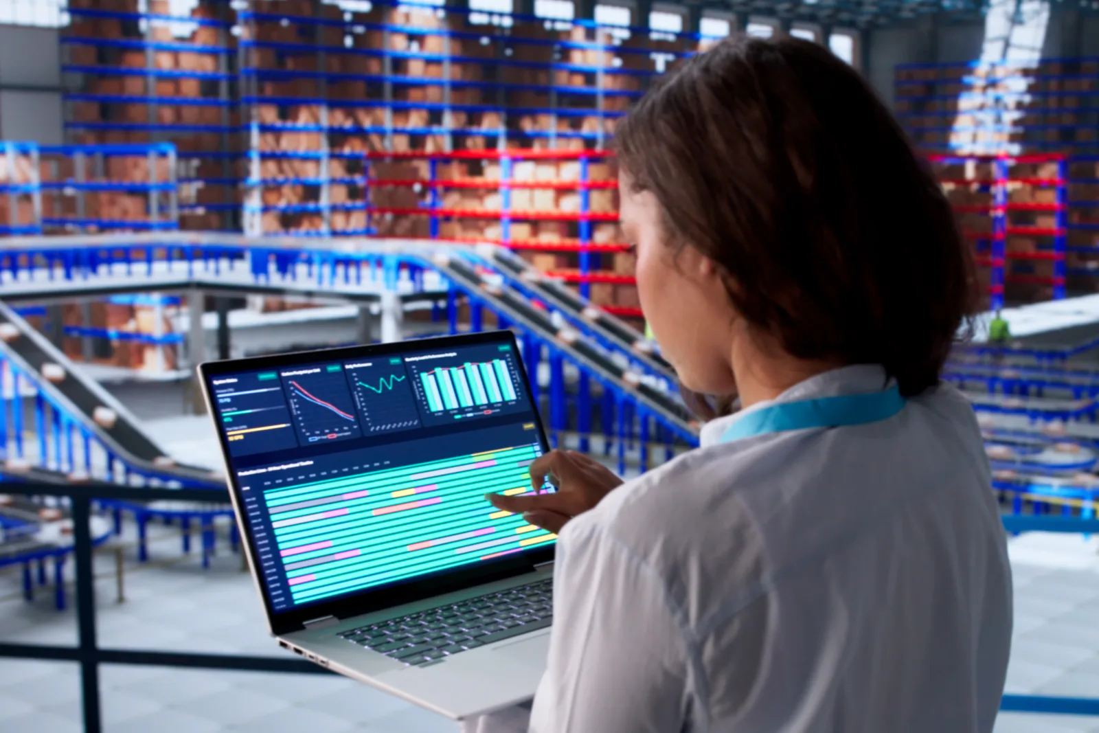 Ecommerce operations team reviewing multichannel inventory and order dashboards together at a laptop
