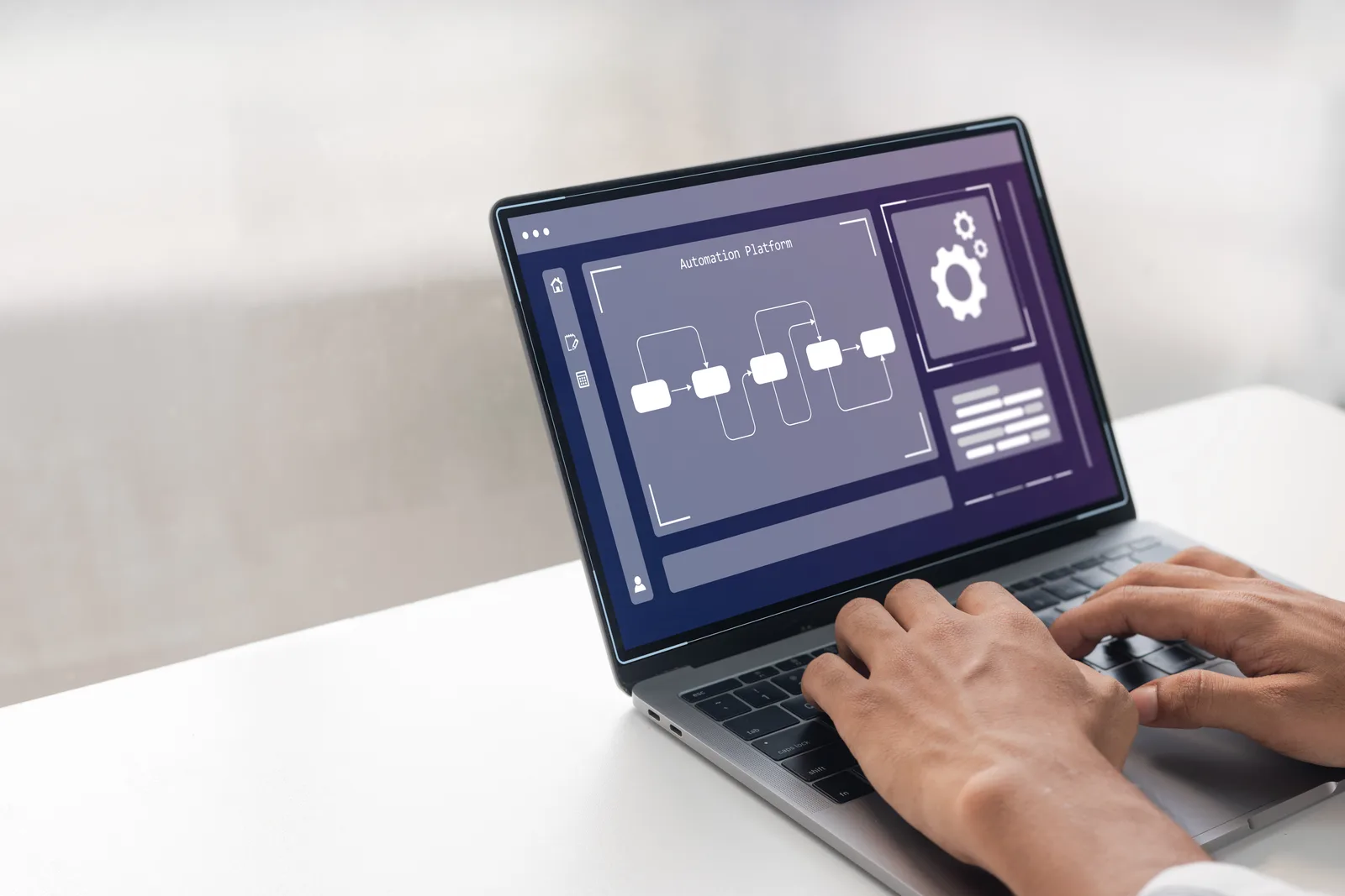 Developer mapping app-to-app workflows and API connections on a laptop dashboard in an office