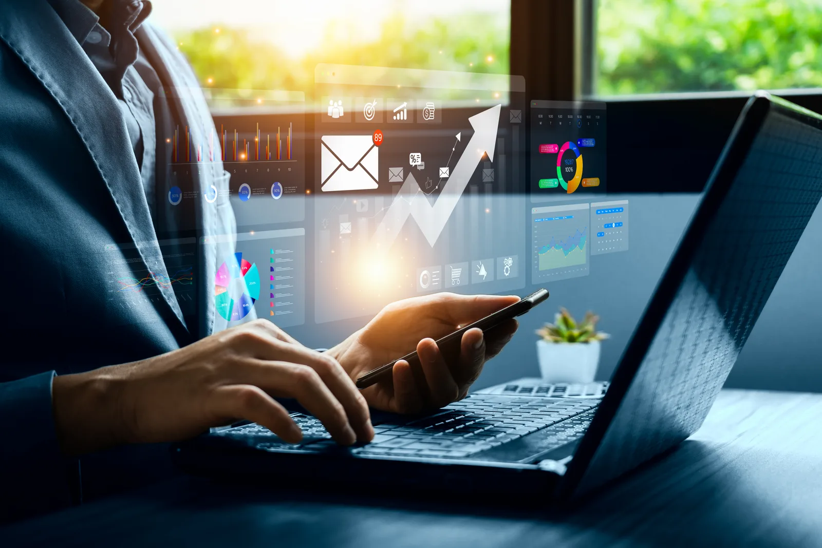 Newsletter publisher writing an issue at a laptop, with subscriber growth and open-rate analytics on screen