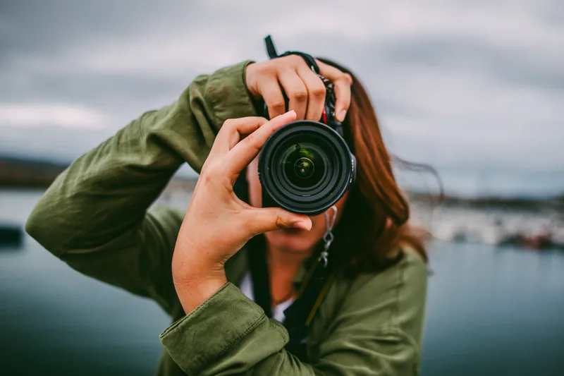Professional photographer using a DSLR camera