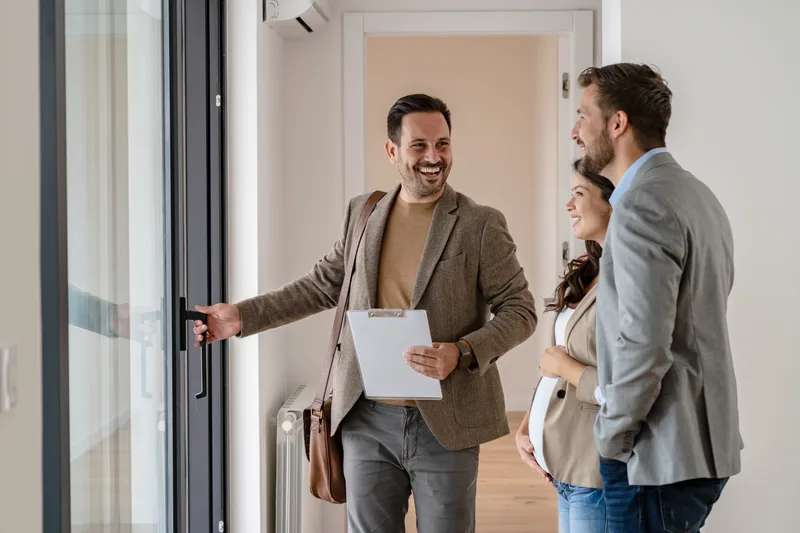 Property manager showing a rental apartment to a couple
