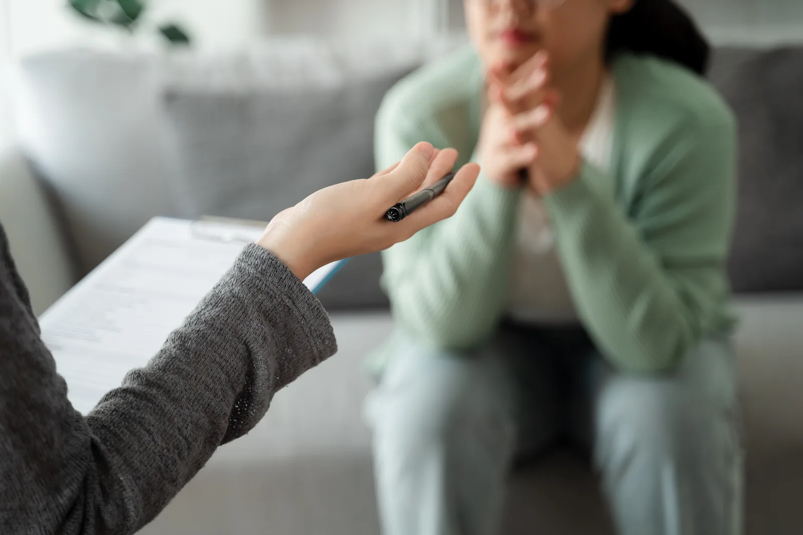 Psychiatrist reviewing a medication management plan with a patient during an office visit