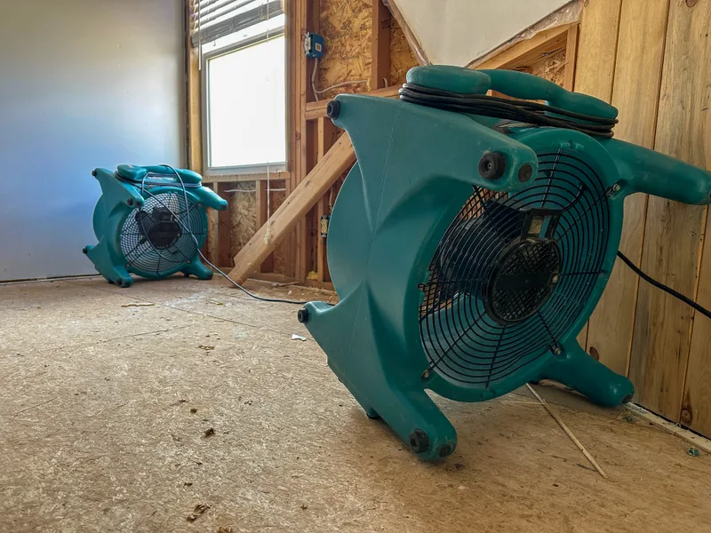Air movers drying a home after water damage