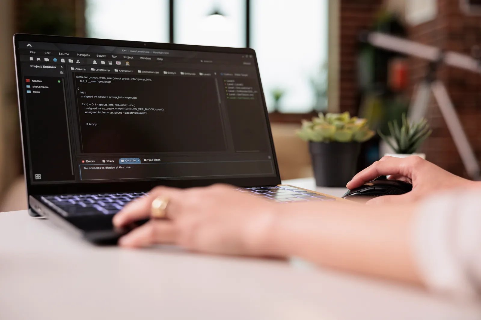Developer writing code for an ecommerce app on a laptop