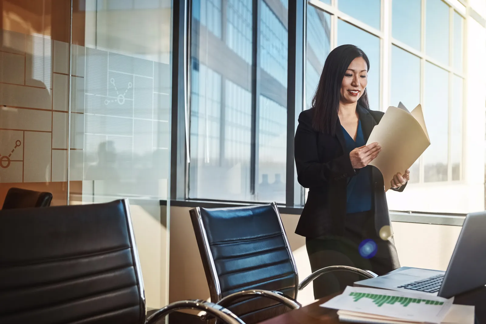 Trade secret attorney reviewing a confidentiality agreement with a corporate client at a conference table