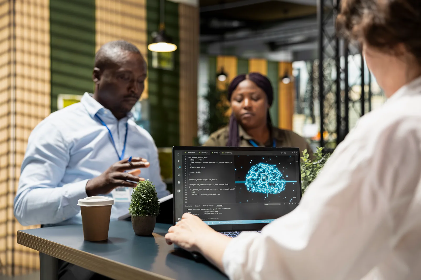 Founders of a vertical AI agent startup reviewing their agent's automated task results together on a laptop