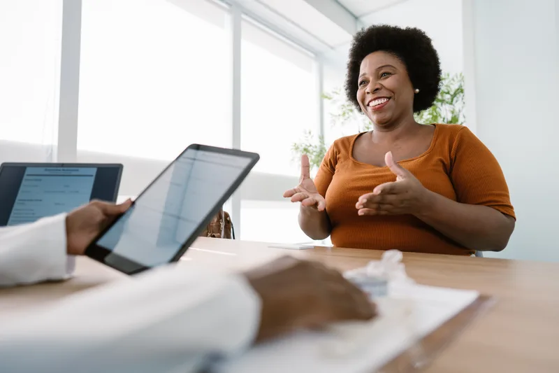 Clinician consulting with a patient about a medical weight-loss plan