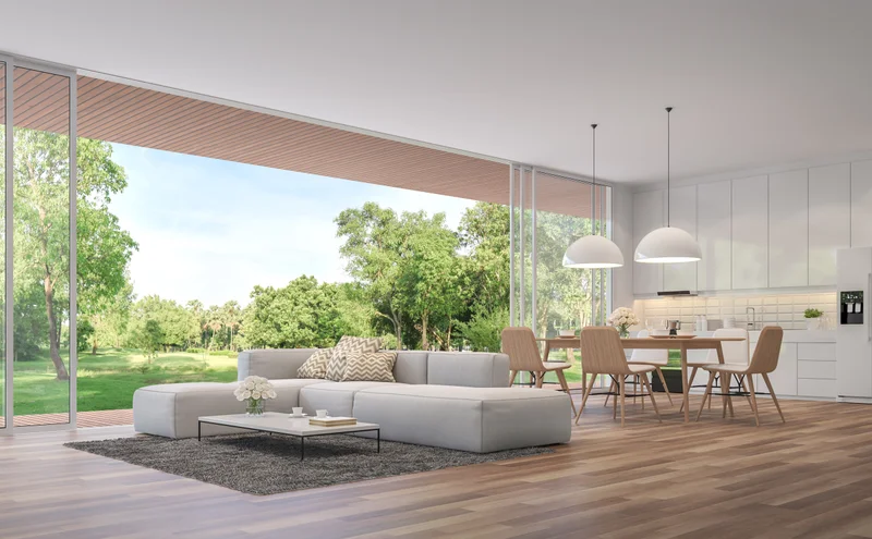 Open living and dining space at 7 Covered Bridge Drive with a full glass wall sliding open to a private lawn