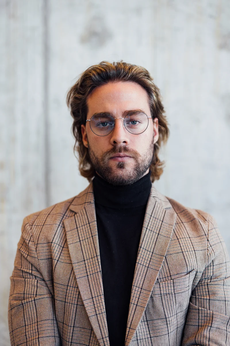 Theo Lindqvist, Cardinal's heritage-home specialist, in a checked blazer and dark turtleneck