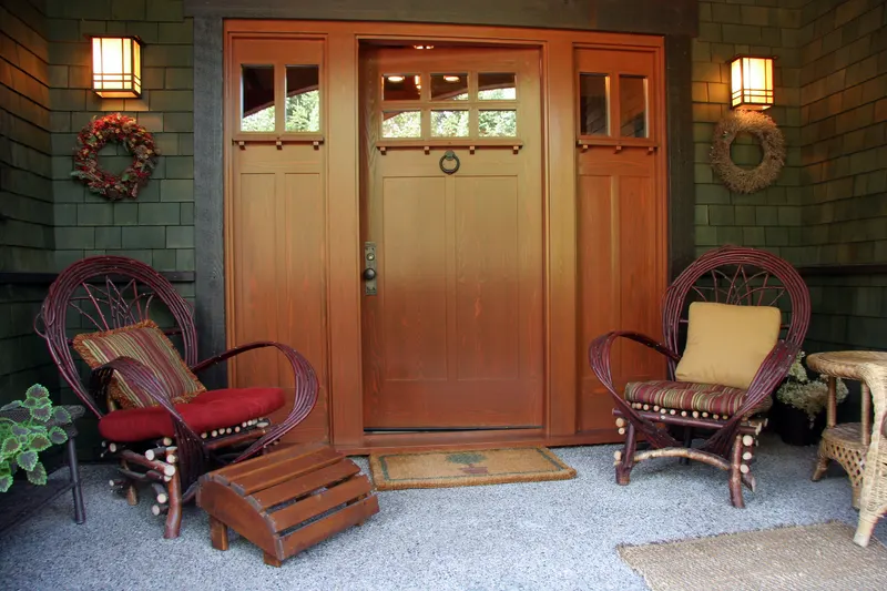 Wood-framed craftsman porch with cedar shingle siding — the construction style where wood-destroying insect checks matter most