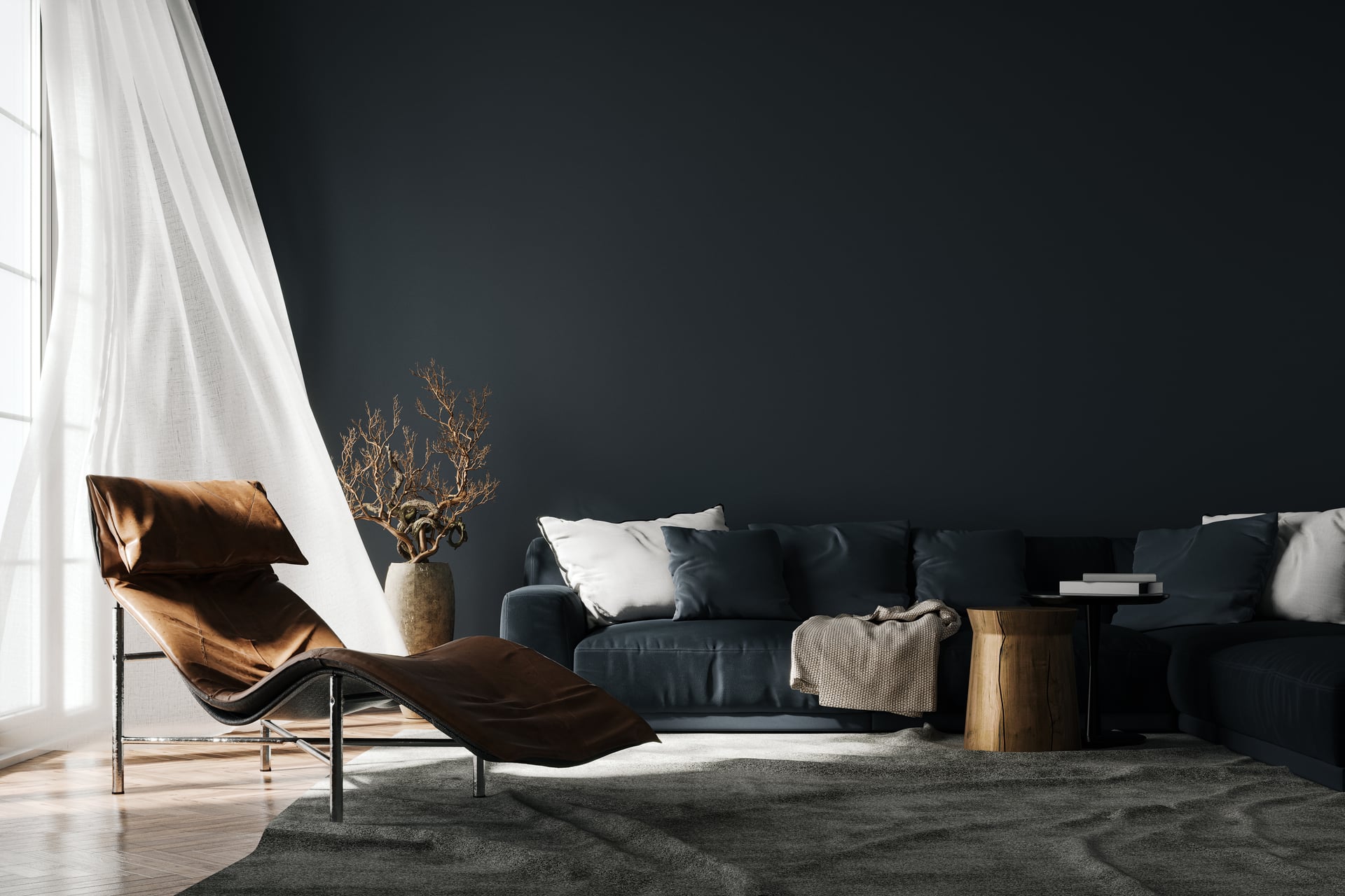 Dusk palette living room: deep ink-blue feature wall behind a navy sofa, cognac leather chaise, smoked-oak floor and sheer white drapery — artist's impression.