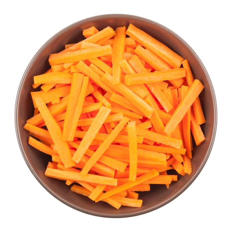 Julienned pickled carrots in a brown bowl, ready for the topping line
